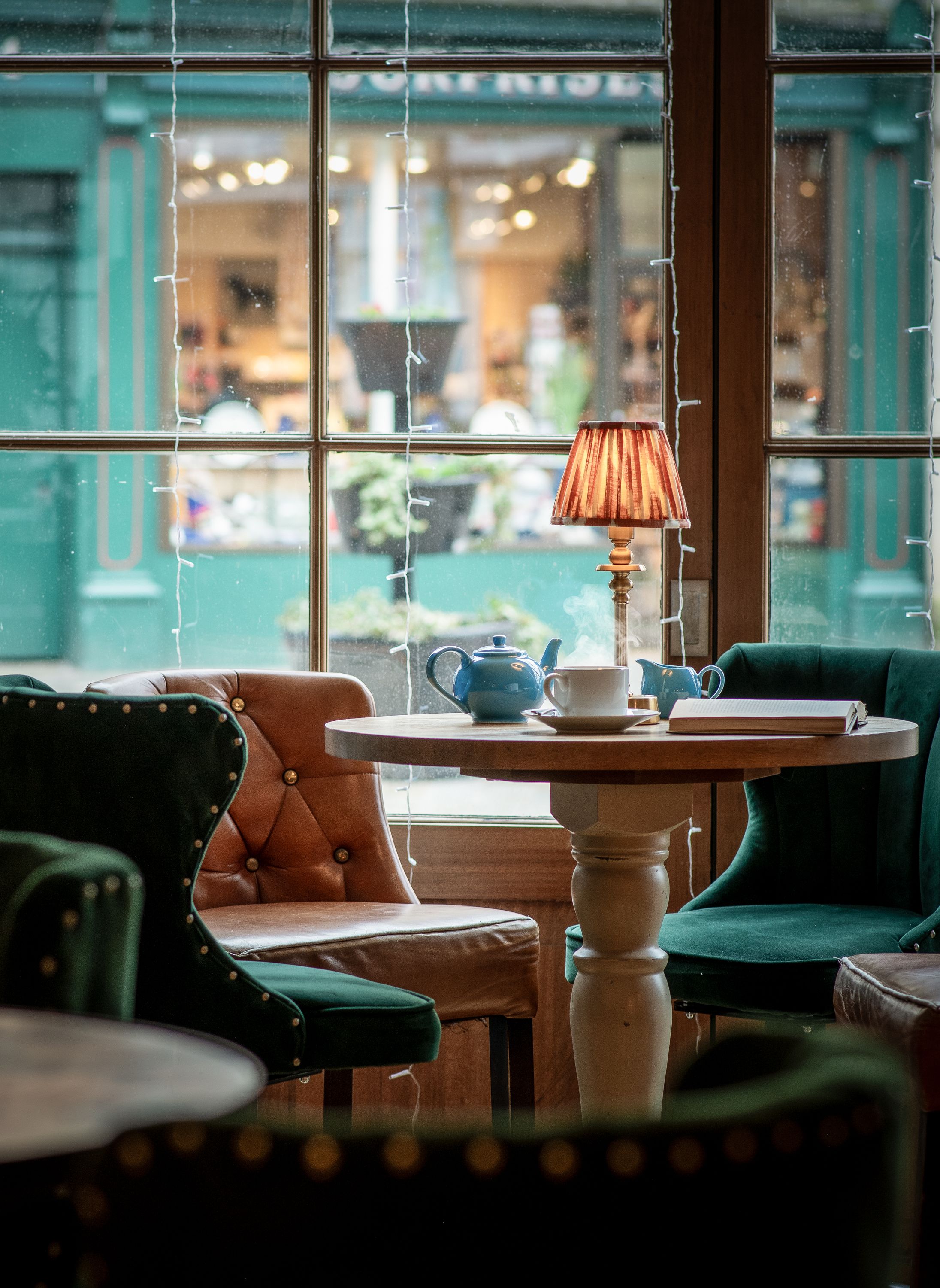 table in the window with tea