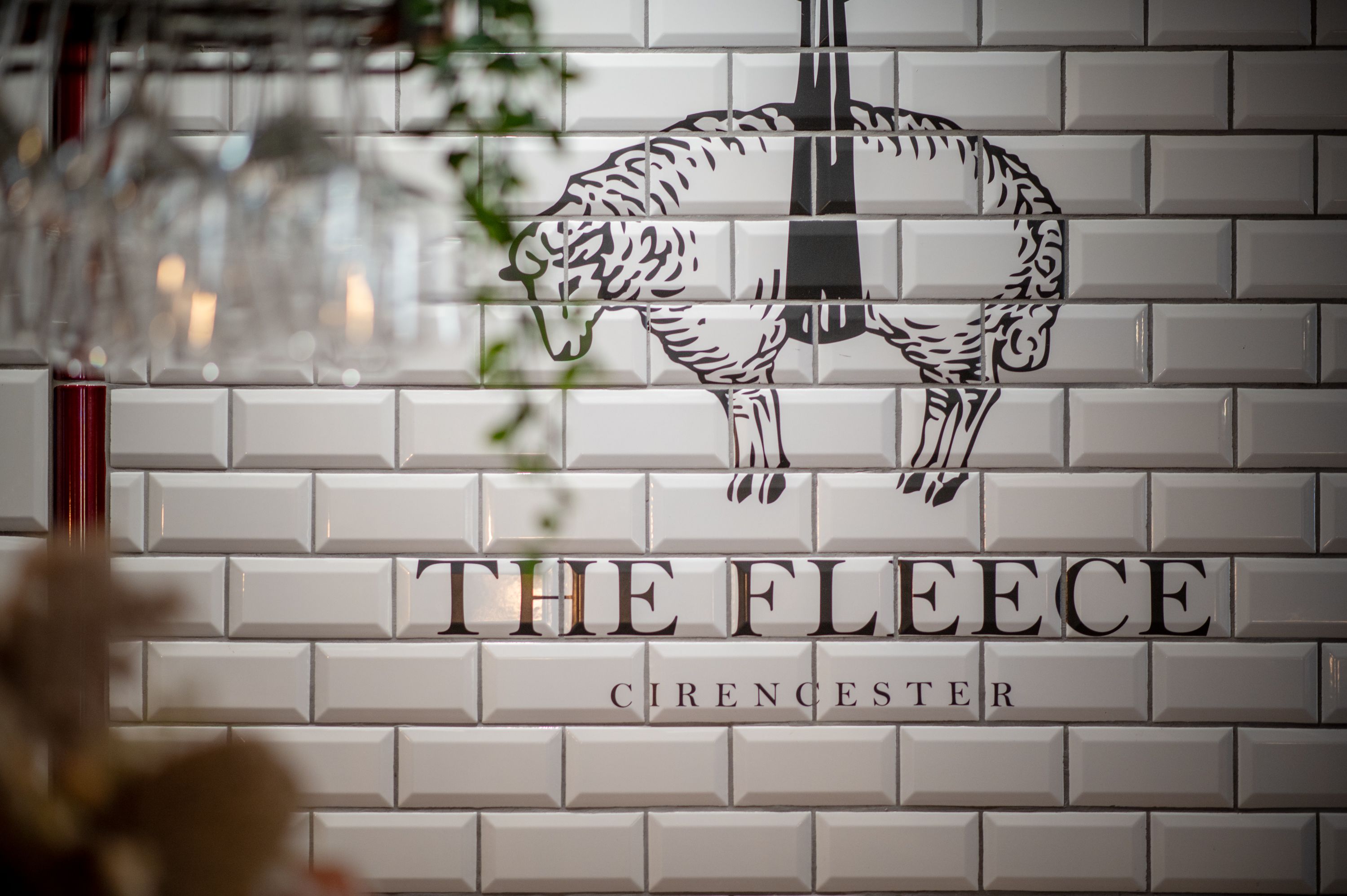 the fleece logo on tiles in the bar