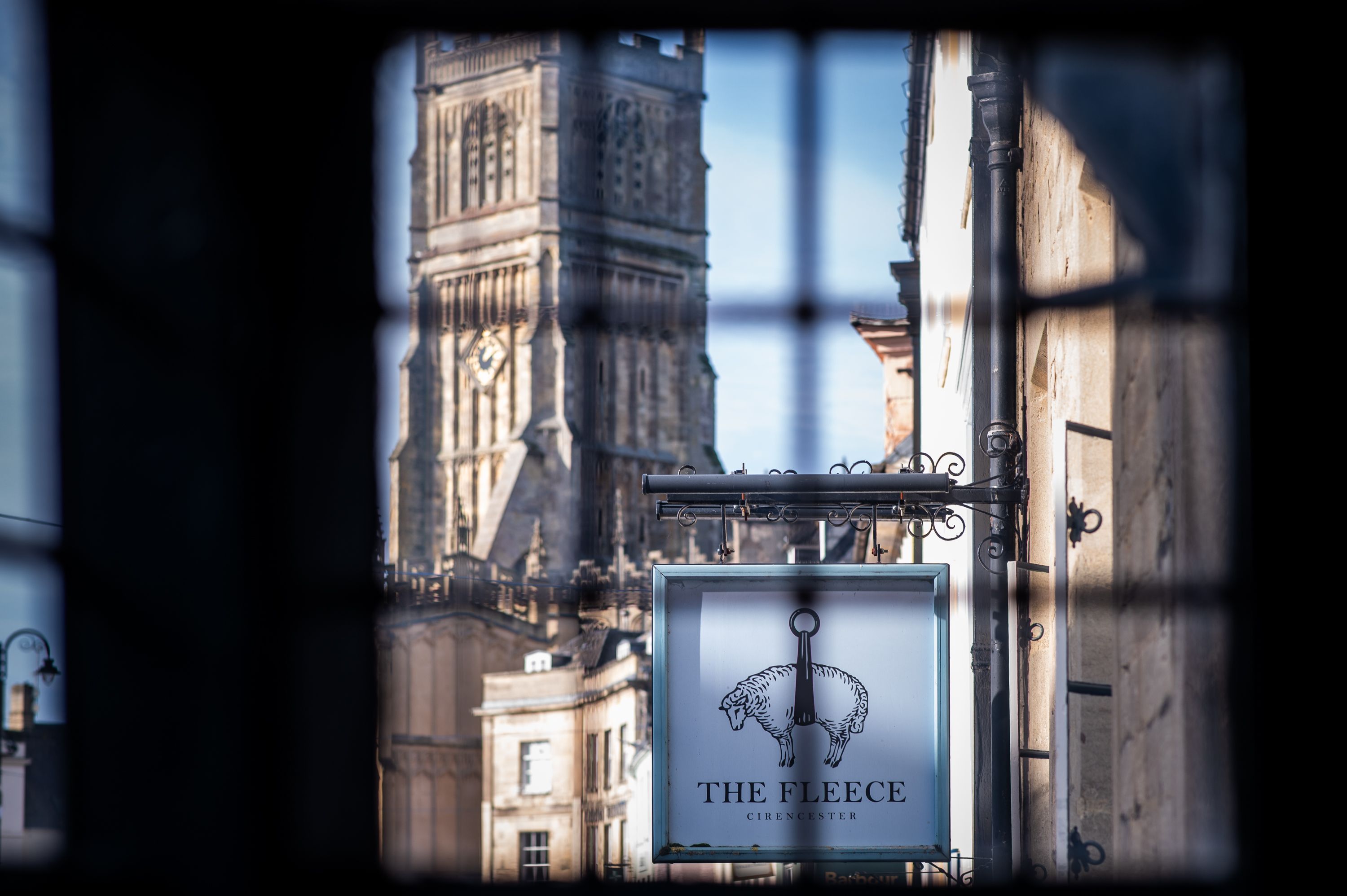 cirencester church through window