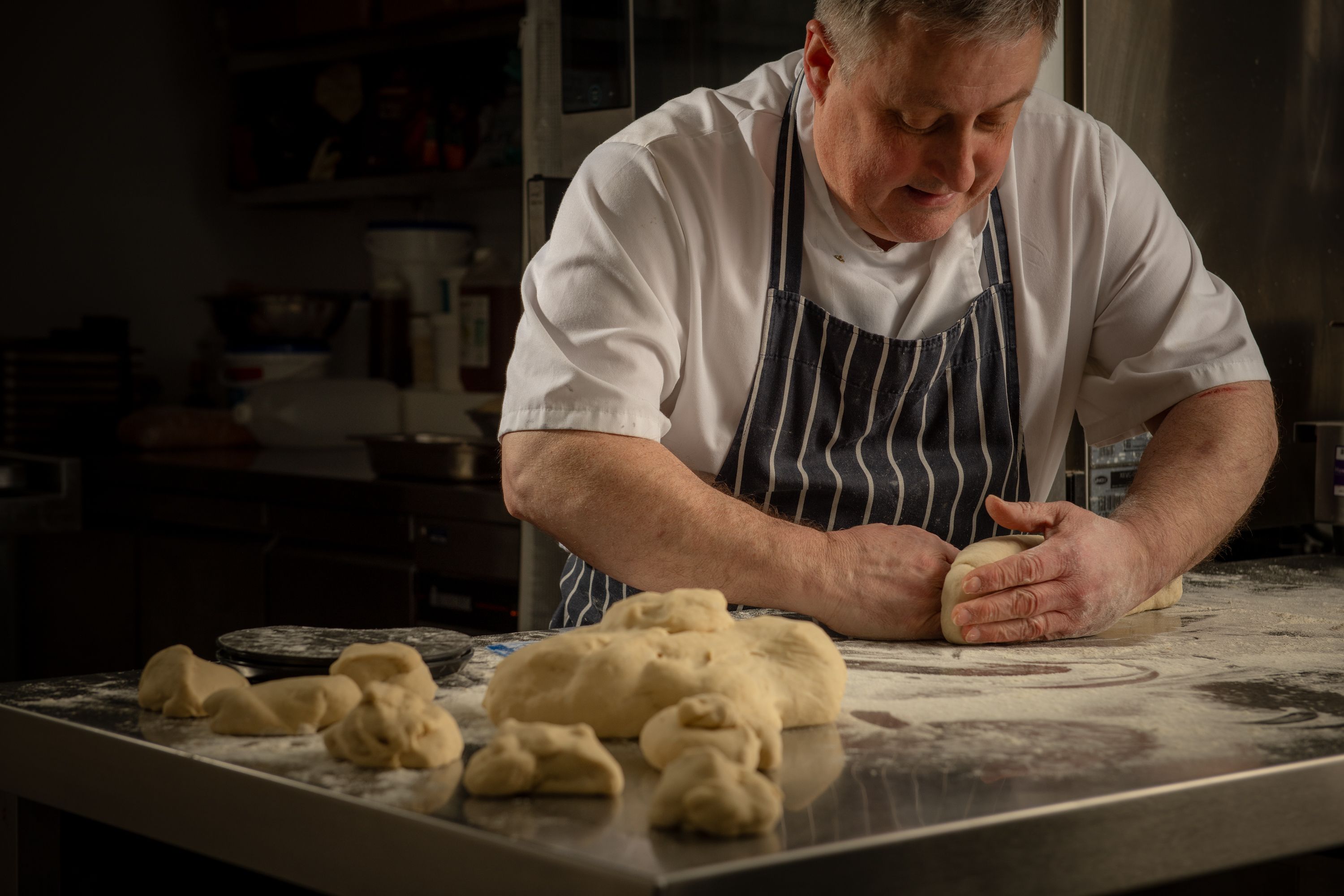 chef creating bread rolls