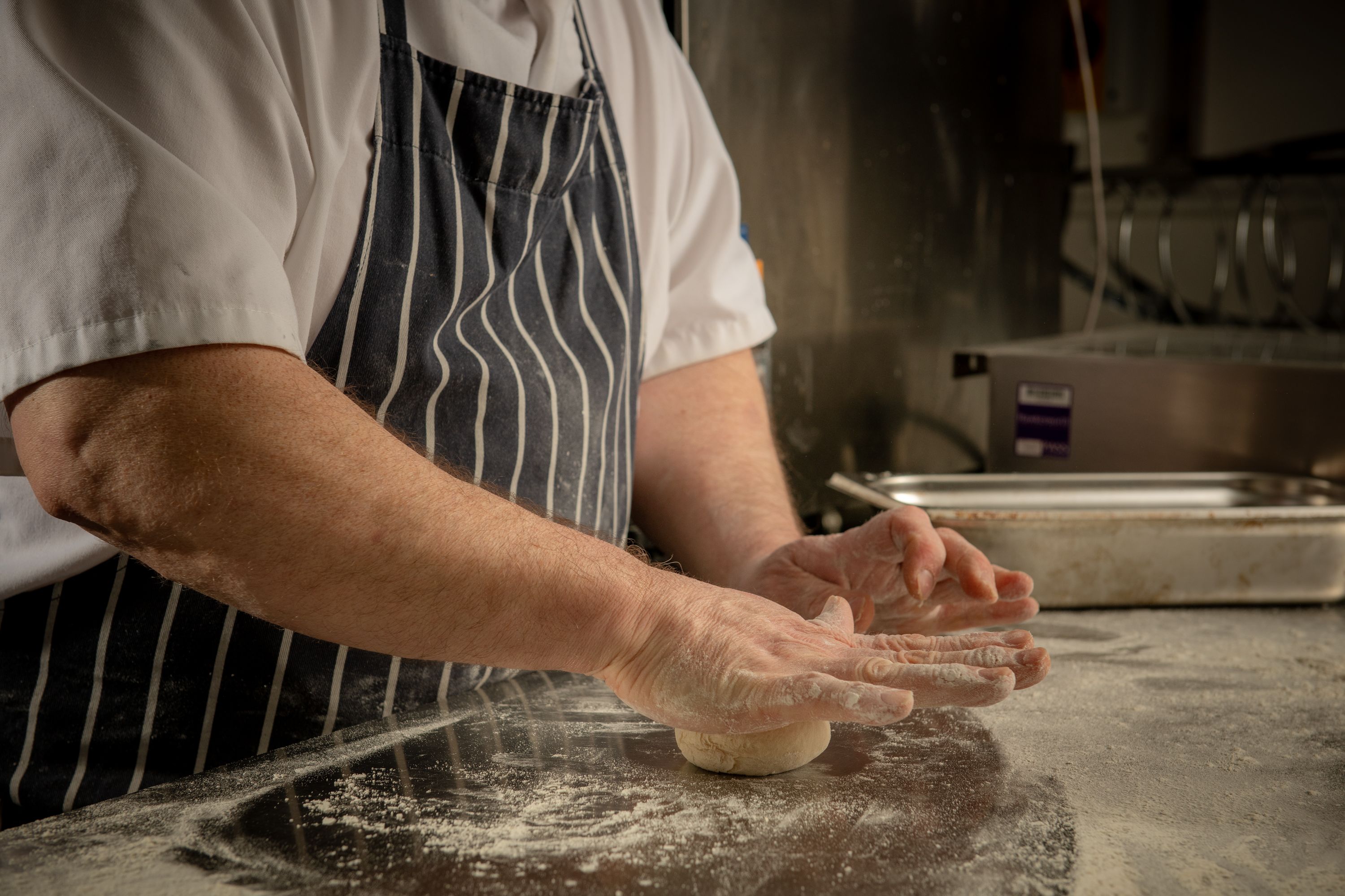 chef making bread with dough