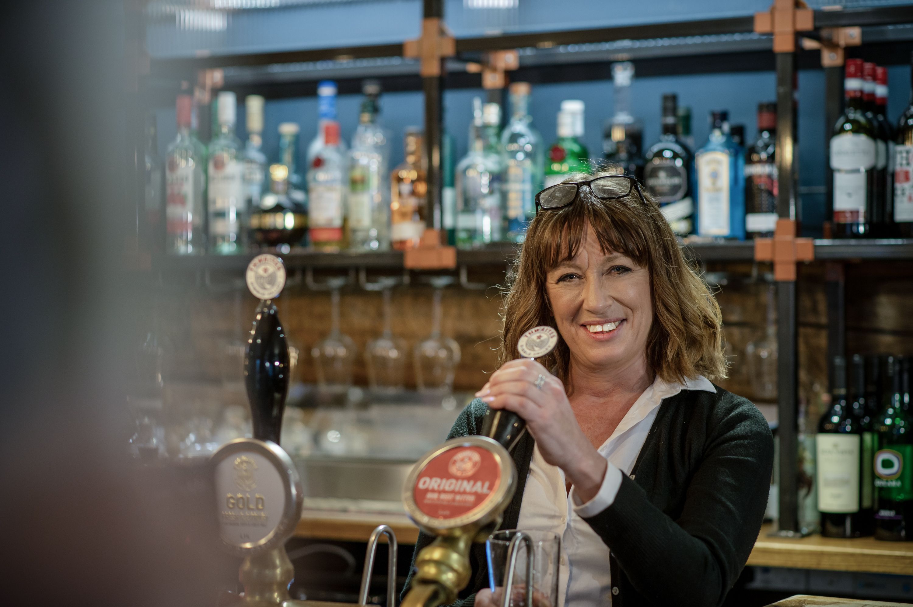 bar staff pouring a pint