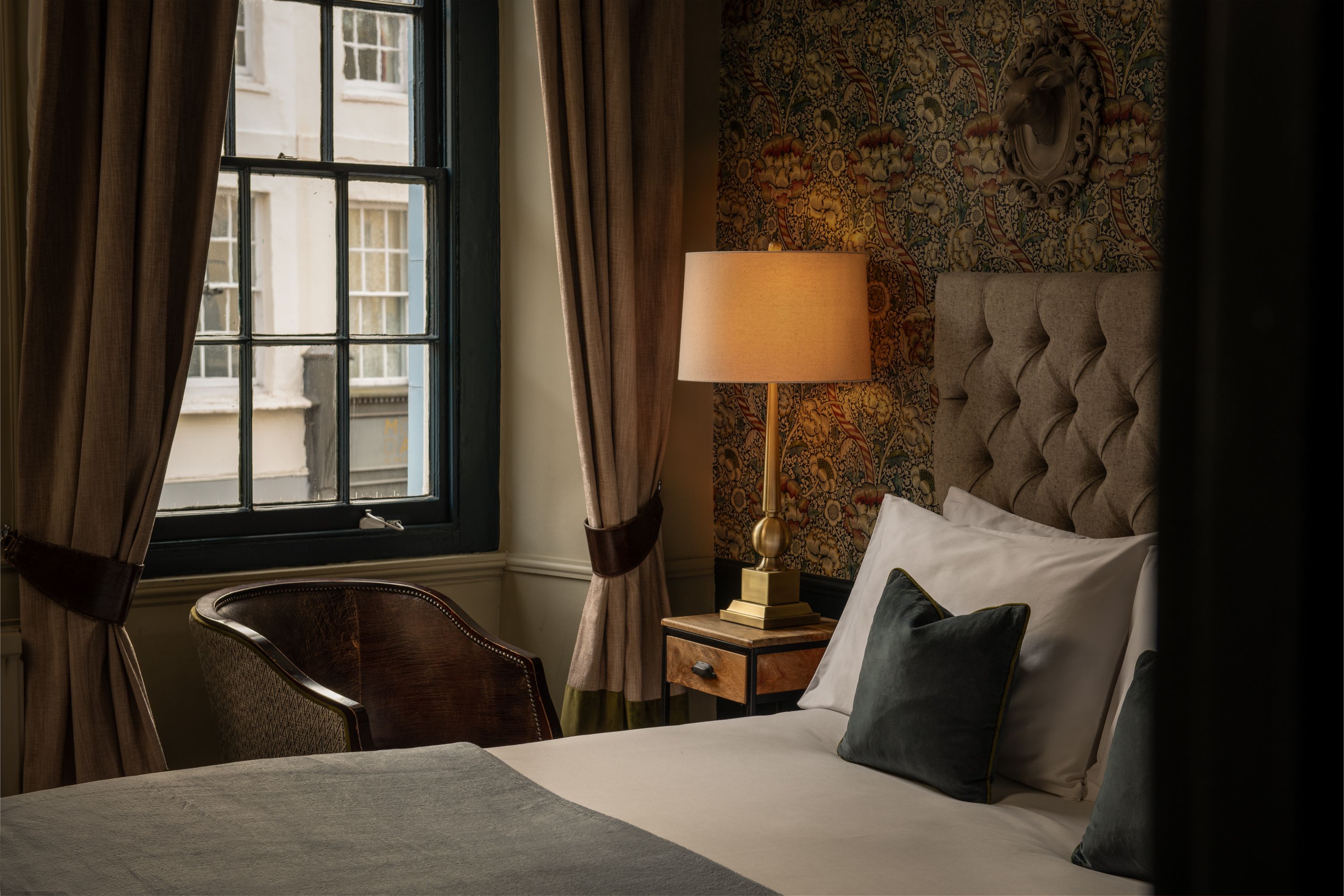 cosy character room with bed side lamp on